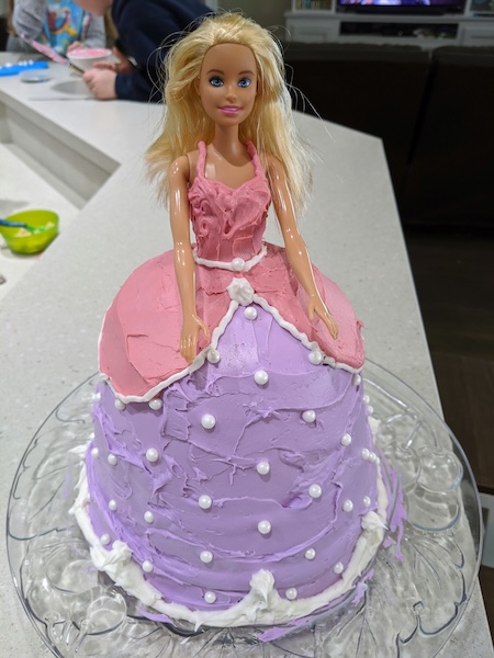 Barbie with a dress-shaped cake