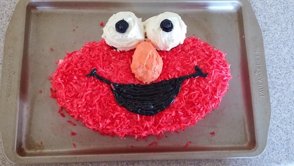 Cake shaped like Elmo from Sesame Street