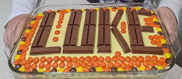 Cake with a name spelled out with Kit-Kats