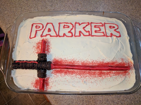 Cake with a Kylo Ren lightsaber made of candies