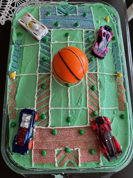 Cake with a Rocket League field replica made from candy