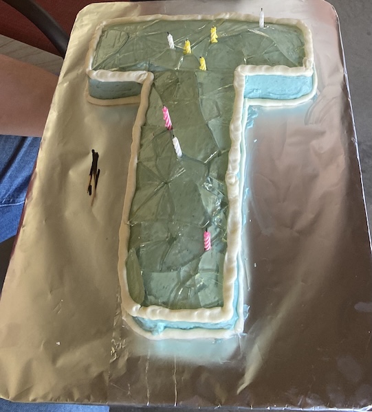 Cake shaped like the Teen Titan tower with candy glass surface