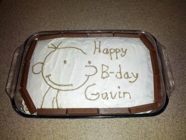 Cake with a drawing of Diary of a Wimpy kid and candy framing